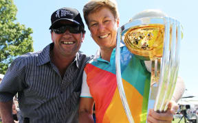 Debbie Hockley, is New Zealand Cricket's first female president.  Pictured here at Hagley Oval in 2014 holding the Cricket World Cup with a fan.