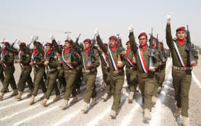 Iraqi Army soldiers march during the graduation ceremony of the Iraqi Army's Non- Commissioned Officers' Academy Junior Leaders Course at Taji Military Complex, Iraq.