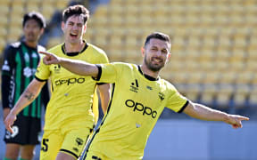 Phoenix forward Kosta Barbarouses celebrates a goal against Western United.