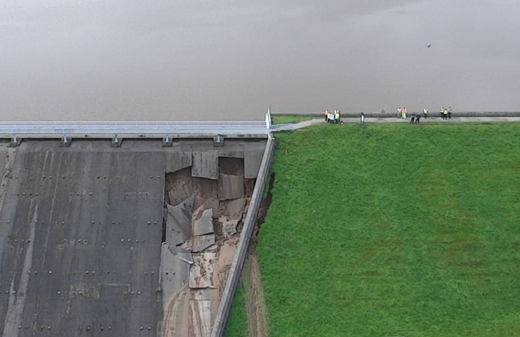 A handout aerial picture released by Derbyshire Constabulary on August 1, 2019 shows damage to the Toddbrook Reservoir dam above the town of Whaley Bridge in northern England on August 1, 2019.