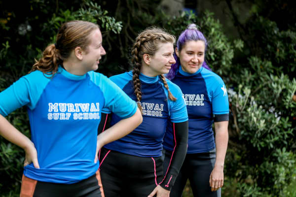 Students at Muriwai Surf School, including Maddy LePage (centre), learn the basics of surfing