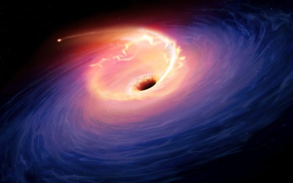 Artwork depicting a tidal disruption event (TDE). TDEs are causes when a star passes close to a supermassive black hole and get torn apart by the gravity of the latter. The debris forms a fan-shaped pattern around the black hole before eventually falling in. (Photo by MGA / Science Photo Library via AFP)