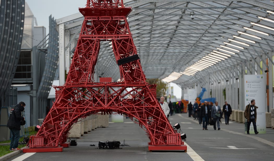 A replica of the Eiffel Tower built with Bistrot chairs installed at the climate summit's venue at Le Bourget, northeast of Paris, on November 29, 2015. AFP PHOTO / MIGUEL MEDINA