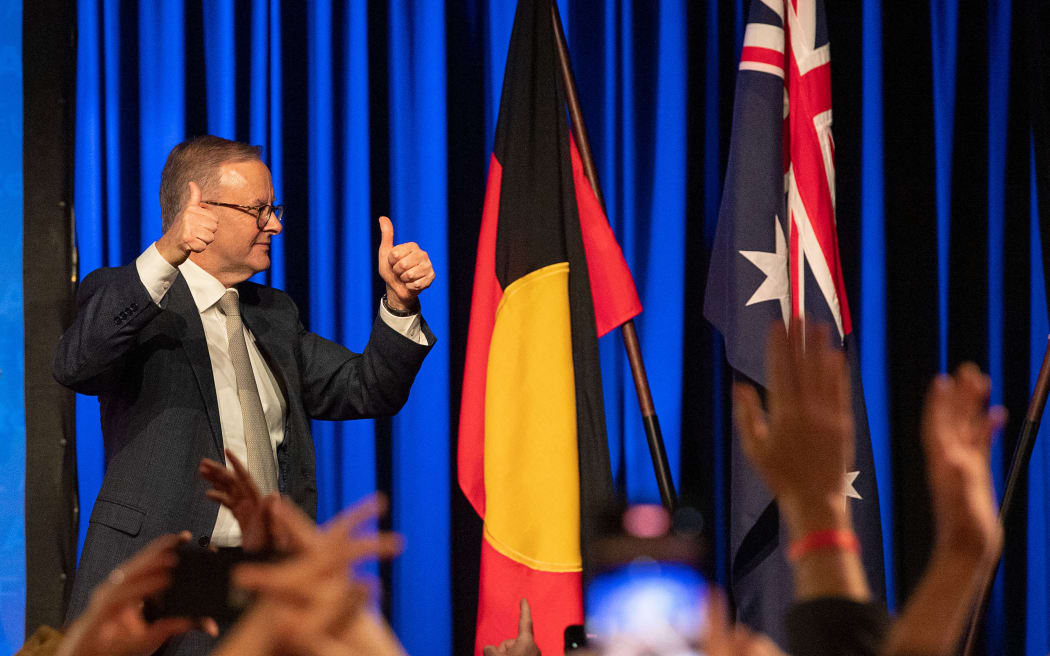 Australian Labor Party leader Anthony Albanese celebrates as he walks off the stage in Sydney on election night after winning the 2022 general election.