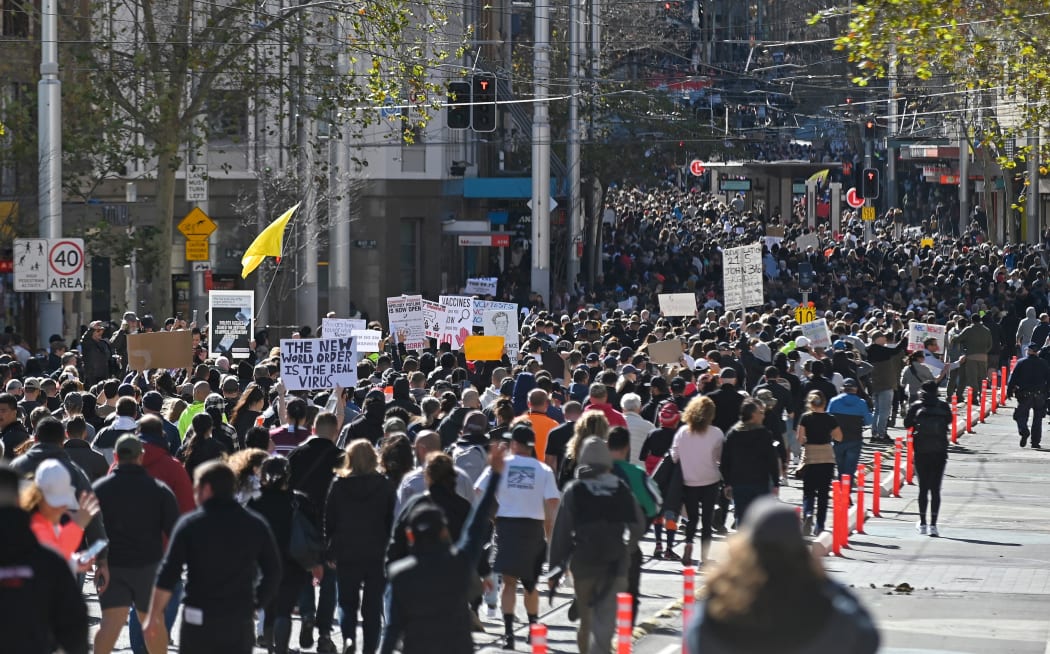 Thousands of anti-lockdown protestors march on the streets of the central business district of Sydney on July 24, 2021,