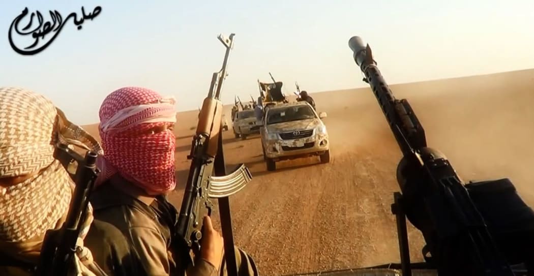 An image taken from a video uploaded to the internet by ISIS allegedly shows them driving in vehicles near the central Iraqi city of Tikrit.