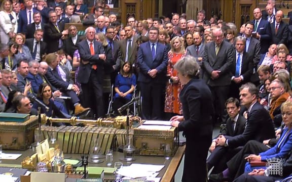 A video grab from footage broadcast by the UK Parliament's Parliamentary Recording Unit (PRU) shows Britain's Prime Minister Theresa May (R) as she speaks in the House of Commons in London on January 15, 2019, after MPs voted to reject the government's Brexit deal.
