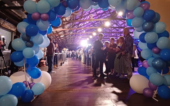 An archway of balloons awaits Christopher Luxon at the National event at Shed 10 in Auckland.