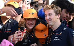 Liam Lawson of Red Bull Racing greets fan on arrival at the Albert Park Circuit in Melbourne, Victoria, Friday, March 14, 2025. (AAP Image/Joel Carrett / Photosport) NO ARCHIVING