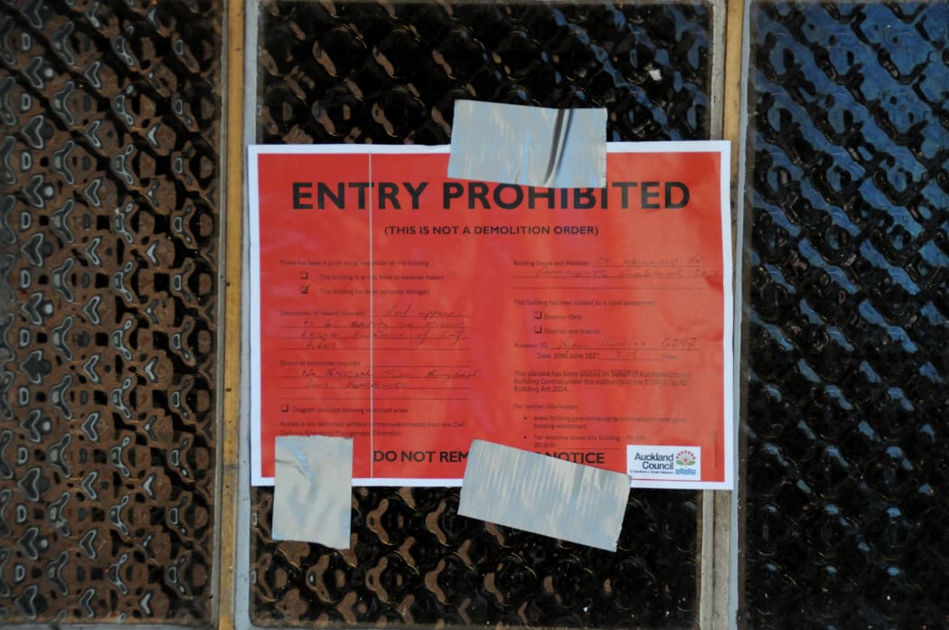 A red sticker on the front door of a property damaged in Saturday’s tornado in Papatoetoe’s Hayward Rd.