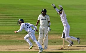 England's Ollie Pope and Jamie Smith run past India's Mohammed Siraj as England win the third test at Lord's, 2025.