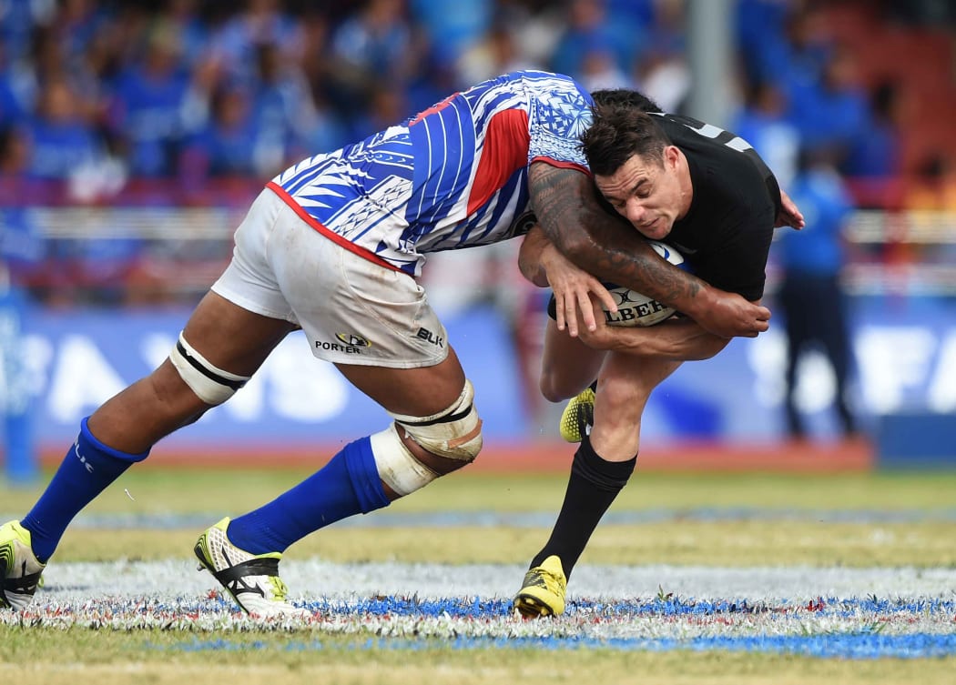 Teofilo Paulo tackles Dan Carter during the All Blacks vs Manu Samoa test in Apia in 2015.