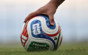 A member of the Iranian national football team reaches for a FIFA official World Cup 2026 ball during a training session at their base camp in Antalya on May 19, 2026. Iran's national football team arrived in Turkey on May 19, 2026 for a training camp and to complete visa applications ahead of the 2026 World Cup, AFP correspondents said. (Photo by Oner SAN / AFP)