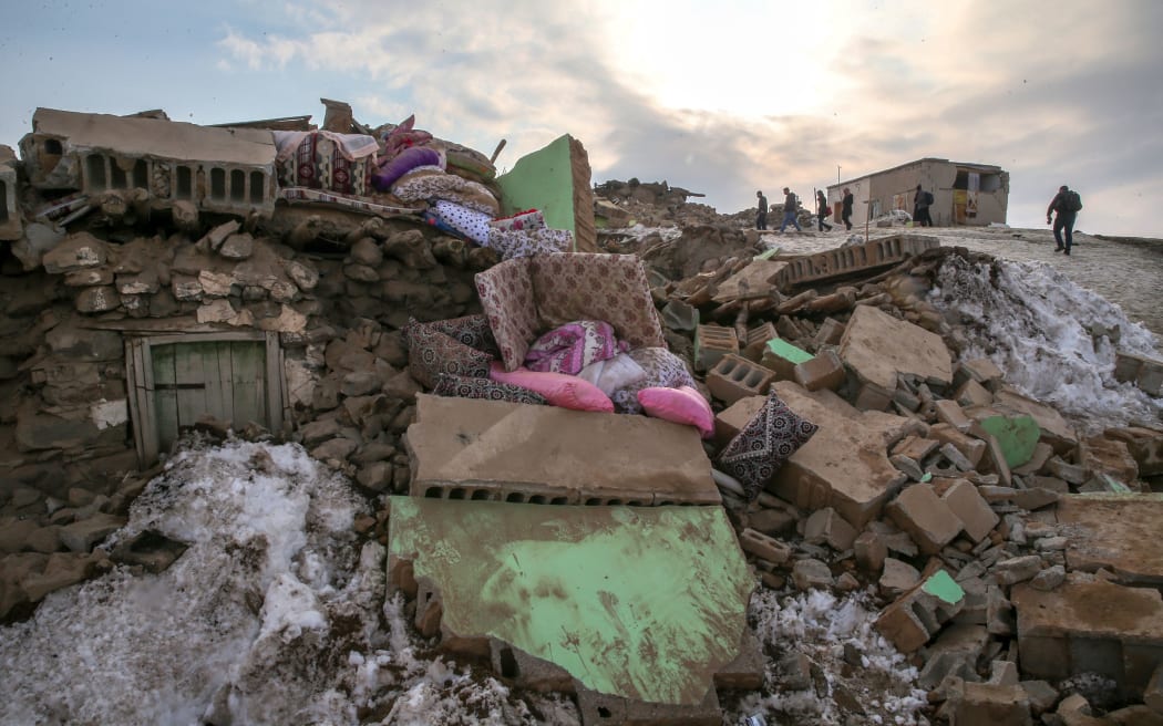 A collapsed building is seen after an earthquake struck near the border with Iran, in Ozpinar neighbourhood of Baskale district in eastern Van province of Turkey on February 23, 2020.