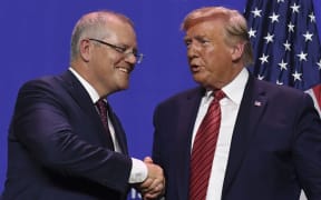US President Donald Trump and Australian Prime Minister Scott Morrison shake hands.