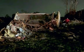 In this still image obtained from the Laurel County Fiscal Court in Kentucky, local residents search through tornado damage in Laurel County near London, Kentucky, on May 17, 2025. More than 20 people have died after severe storms swept through the southern US states of Missouri and Kentucky, officials and local media reports said May 17, 2025. Kentucky governor Andy Beshear said on X that at least 14 people had died in Friday night's storms. At least seven people were killed in Missouri, the Washington Post reported. (Photo by Handout / Laurel County Fiscal Court / AFP) / RESTRICTED TO EDITORIAL USE - MANDATORY CREDIT "AFP PHOTO / LAUREL COUNTY FISCAL COURT" - NO MARKETING NO ADVERTISING CAMPAIGNS - DISTRIBUTED AS A SERVICE TO CLIENTS