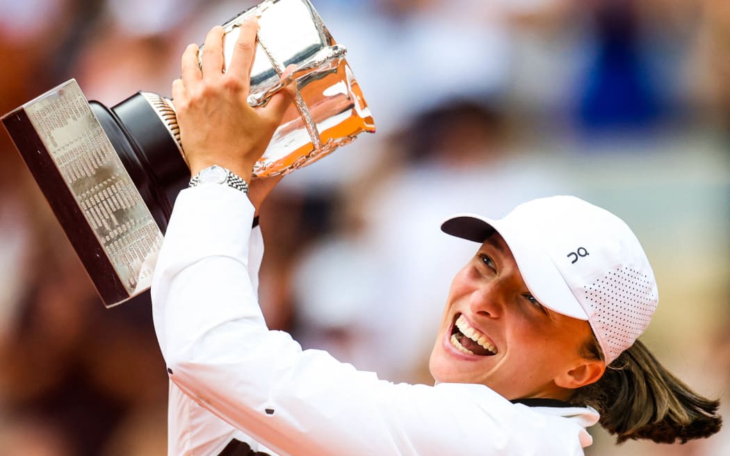 Iga SWIATEK (POL) holds the winners trophy after victory against Karolina MUCHOVA (CZE) on Philippe-CHATRIER court in the French Open Roland Garros 2023 women final.