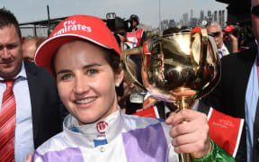 Michelle Payne celebrates after winning the Melbourne Cup on Prince of Penzance at Flemington Racecourse in Melbourne, Tuesday, Nov. 3, 2015.