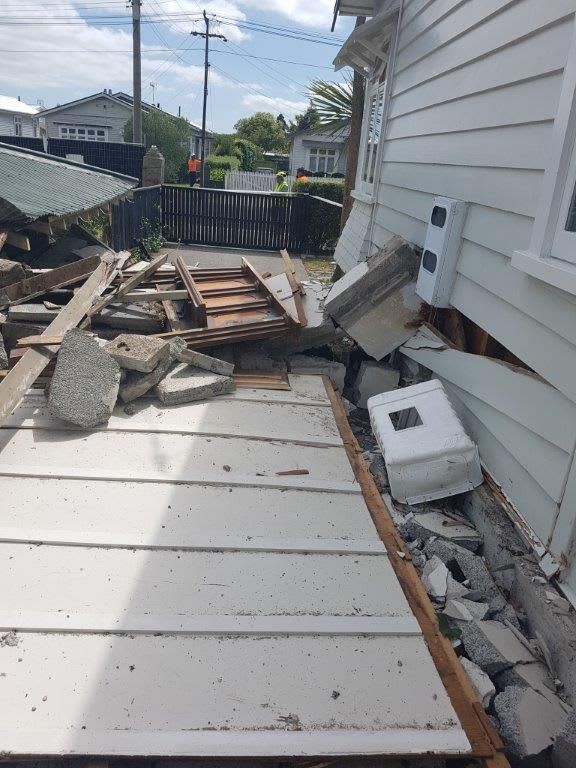 The damage caused by the fallen chimney.