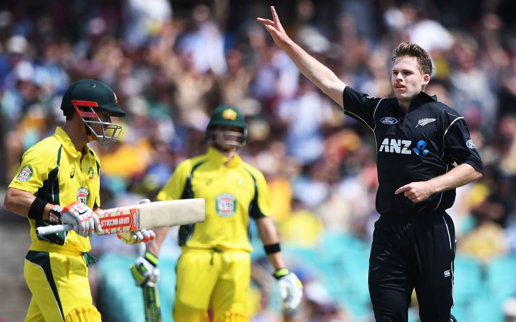 Lockie Ferguson celebrates the wicket of David Warner.