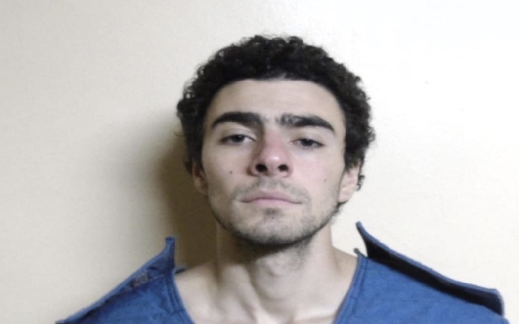 This December 9, 2024, booking photo obtained from the Pennsylvania Department of Corrections shows Luigi Mangione. - Mangione, 26, was arrested December 9 over the targeted killing of a health insurance executive on the streets of New York, with investigators charging him with possession of fake IDs and a gun. Investigators continued to interrogate Mangione in connection with last week's brazen murder, which triggered a nationwide manhunt and global headlines. (Photo by Handout / Pennsylvania Department of Corrections / AFP) / RESTRICTED TO EDITORIAL USE - MANDATORY CREDIT "AFP PHOTO / PENNSYLVANIA DEPARTMENT OF CORRECTIONS" - NO MARKETING NO ADVERTISING CAMPAIGNS - DISTRIBUTED AS A SERVICE TO CLIENTS