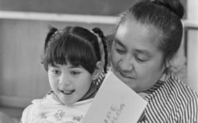 Samoan pre-school administrator Fereni Ete, reading a story in Samoan, Wellington, 1988 Evening Post newspaper