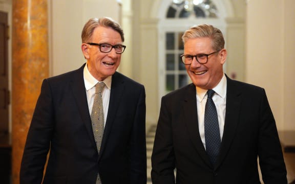 British Prime Minister Keir Starmer (R) talks with Britain's Ambassador to the United States Peter Mandelson during a welcome reception at the ambassador's residence on February 26, 2025 in Washington, DC. British Prime Minister Keir Starmer is on his first visit to Washington since US President Donald Trump returned to the White House. (Photo by Carl Court / POOL / AFP)