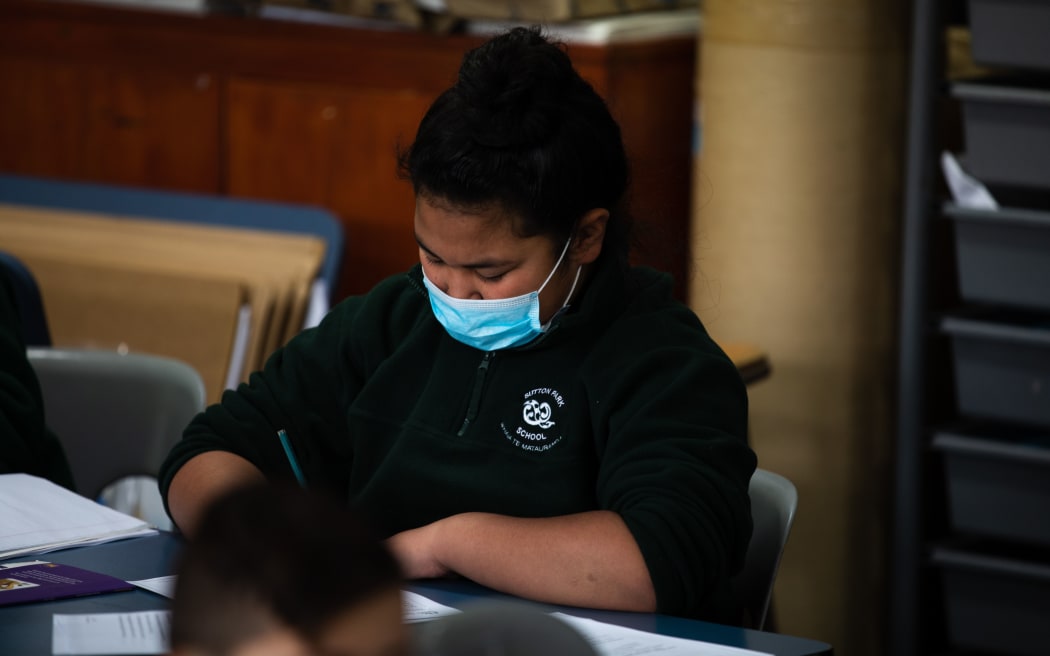 An Auckland child wearing a mask at school.