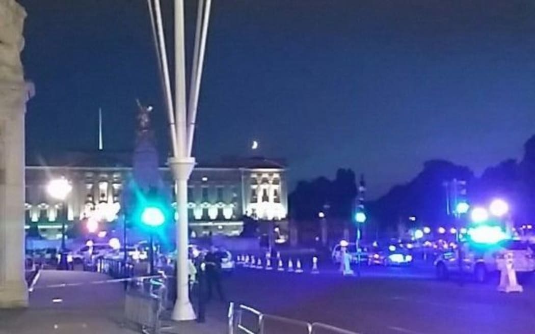This picture taken from the Twitter account of Matt Vincent, shows policemen guarding the streets outside Buckingham Palace in London.