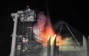 Firefighters prepare to tackle the fire blazing in the St Paul's Cathedral roof at 3.30am on Tuesday.