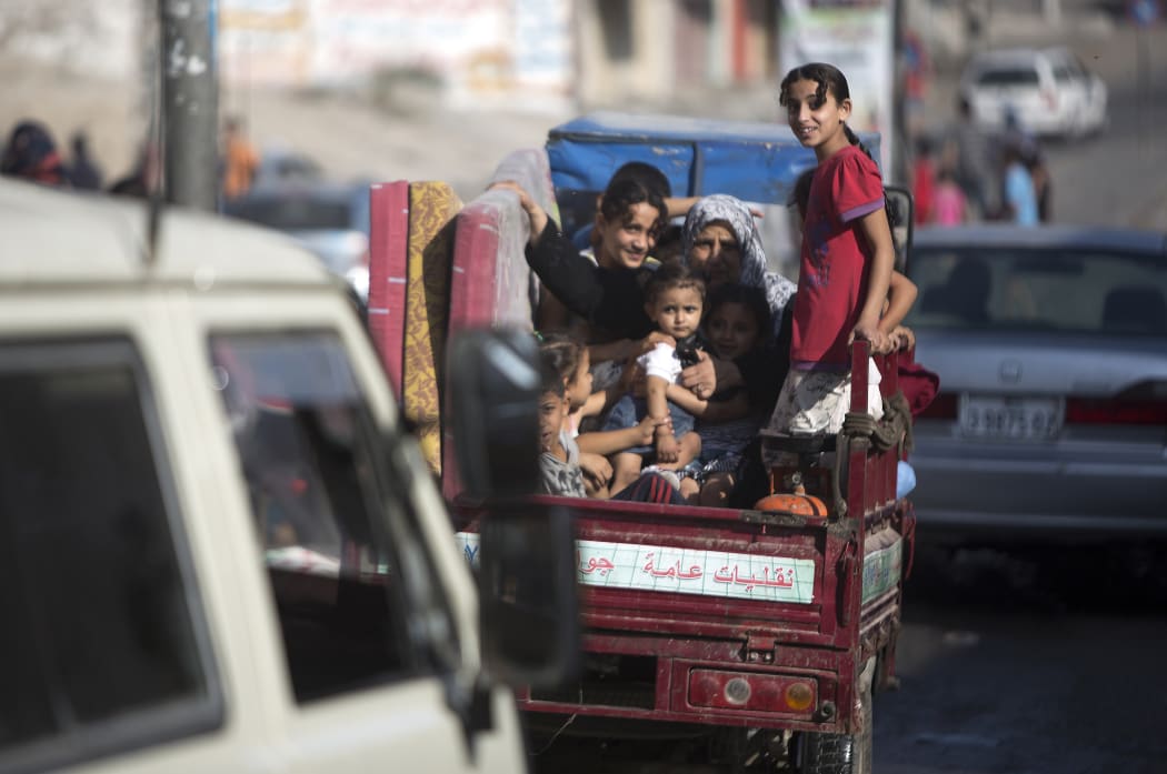 Families leave their homes after Palestinian factions in Gaza refused to extend the 72-hour ceasefire with Israel.