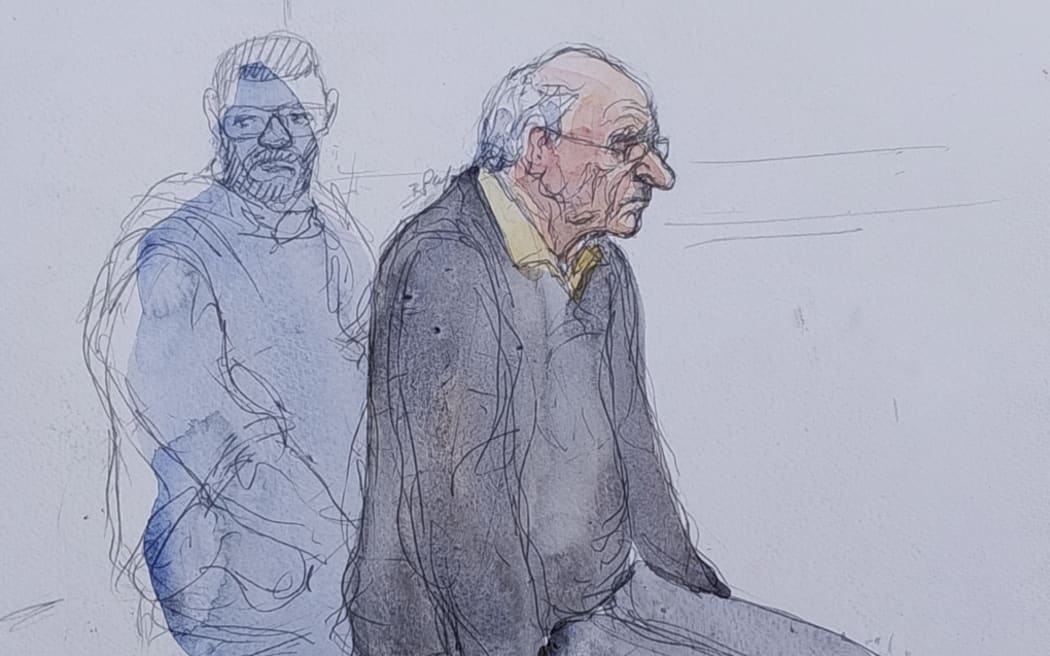 (FILES) This court sketch created on May 23, 2025, shows the defendant, French retired surgeon Joel Le Scouarnec listening during a hearing in his trial on charges of rape and sexual assault of 299 former patients, at the courthouse of Vannes, western france, on May 23, 2025. A French court on May 28, 2025 gave the maximum 20-year jail term to a surgeon who admitted sexually abusing hundreds of patients, most of them children, during more than two decades. (Photo by Benoit PEYRUCQ / AFP)