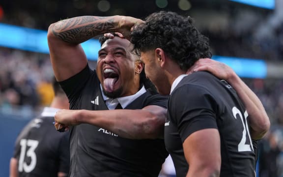 Leicester Fainga'anuku of the All Blacks celebrates a try by Wallace Sititi against Ireland in Chicago, 2025.