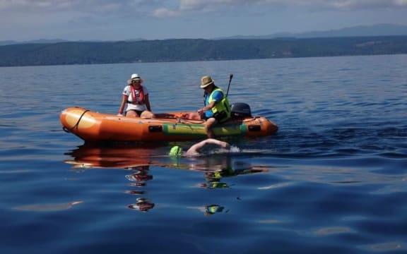 Caitlin O'Reilly swimming across Lake Taupō