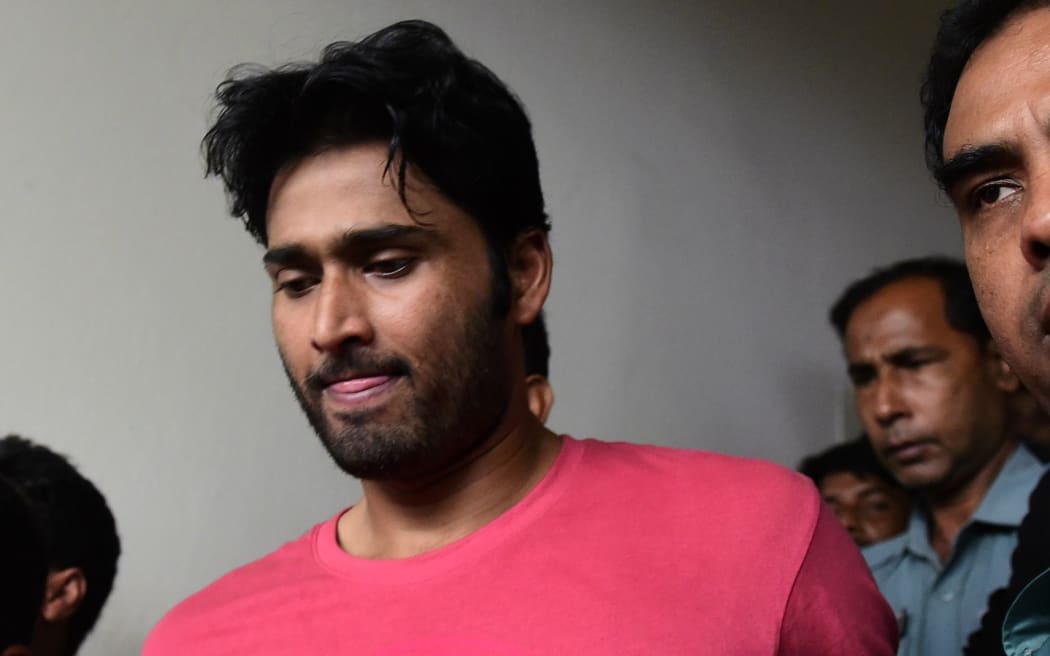 Shahadat Hossain after he surrendered to police in Dhaka.