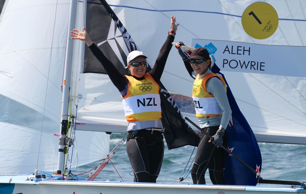 2012 Olympic Gold Medalists, Jo Aleh and Olivia Powrie (NZL Womens 470) celebrate their wind in front of the crowd and media on the Nothe course after winning their Gold Medal.
