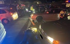Police intercepting a boy-racer met of 100 vehicles at Kmart in Petone.
