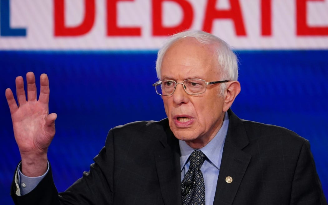 Democratic presidential hopeful Senator Bernie Sanders makes a point as he and former US vice president Joe Biden take part in the 11th Democratic Party 2020 presidential debate in a CNN Washington Bureau studio in Washington, DC