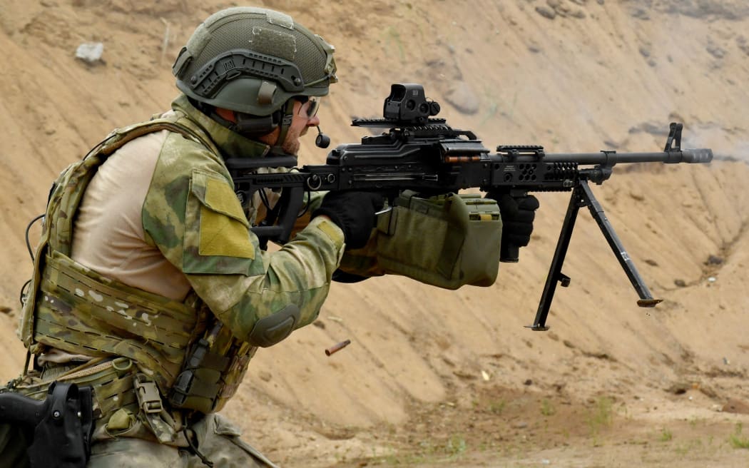 A soldier of the Russian Interior Ministry shoots with a weapon during the All-Russian shooting competition "Forever Alive" in Saint Petersburg on August, 25, 2022.