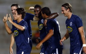 Auckland's Joao Moreira celebrates his goal with his team-mates.
