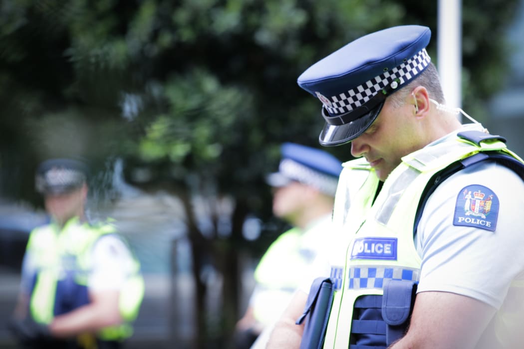 Police standing at a cordon