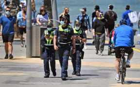 Protective Services Officers patrol along Melbourne's St Kilda Beach on 8 November, 2020 as Victoria's state government announces an easing of restrictions with no new cases of Covid-19 recorded for the ninth day in a row.