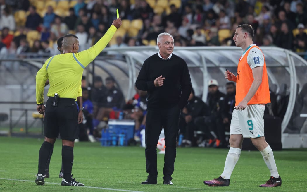 All Whites skipper Chris Wood is shown a yellow card.