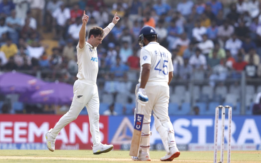 Matt Henry of New Zealand celebrates the wicket of Rohit Sharma (C) of India during day 1 of the 3rd Test Match between India and New Zealand held at the Wankhede Stadium, Mumbai, India on the 1st November 2024

Photo by Vipin Pawar / Sportzpics for BCCI