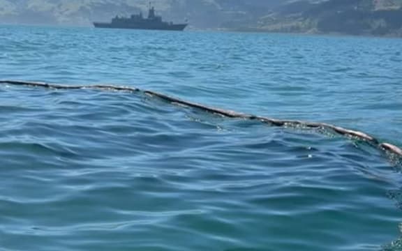 Oil spill from HMNZS Te Kaha is contained on Akaroa Harbour.