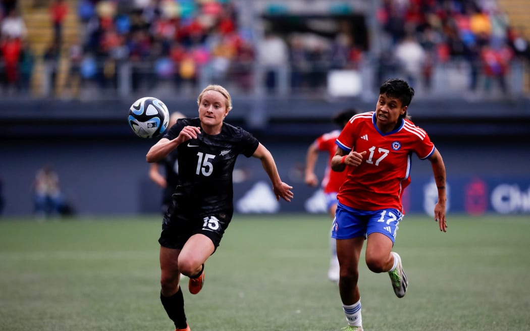 Paige Satchell of New Zealand Football Ferns (L) and Fernanda Pinilla of Chile.
