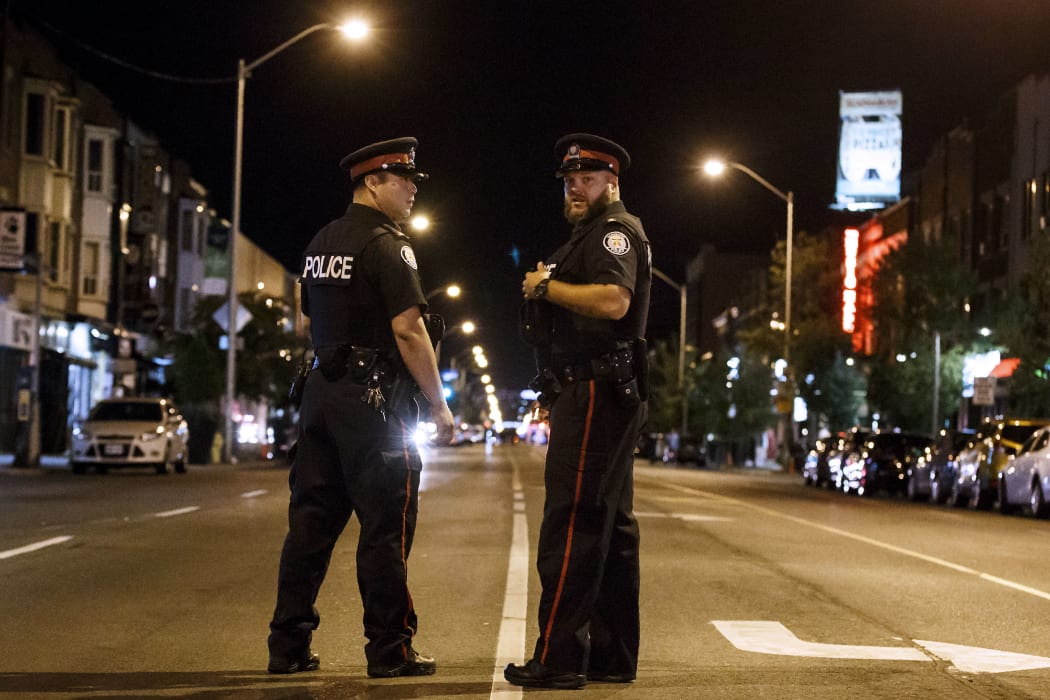 A gunman opened fire in central Toronto, injuring 13 people including a child.
