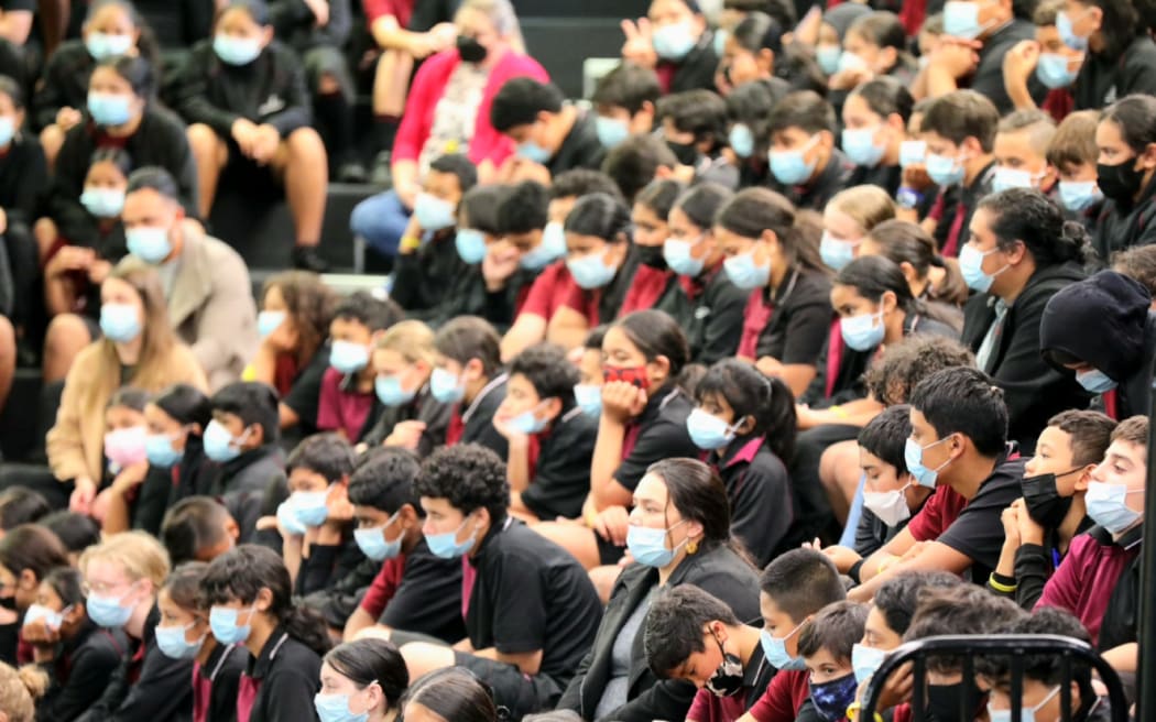School students watch on as Associate Education Minister Jan Tinetti announces a plan to improve declining school attendance