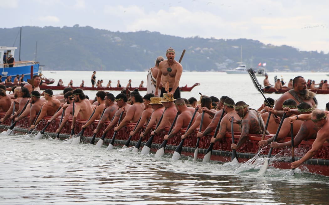 Kaihoe power their way through the moana during the annual waka parade at Te Tii beach.