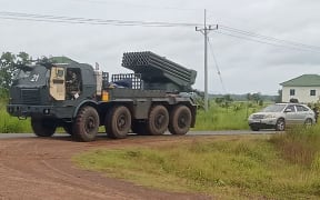 A Cambodian BM-21 multiple rocket launcher returns in Preah Vihear province from the Cambodia-Thai border as troops from both sides clash on 24 July.